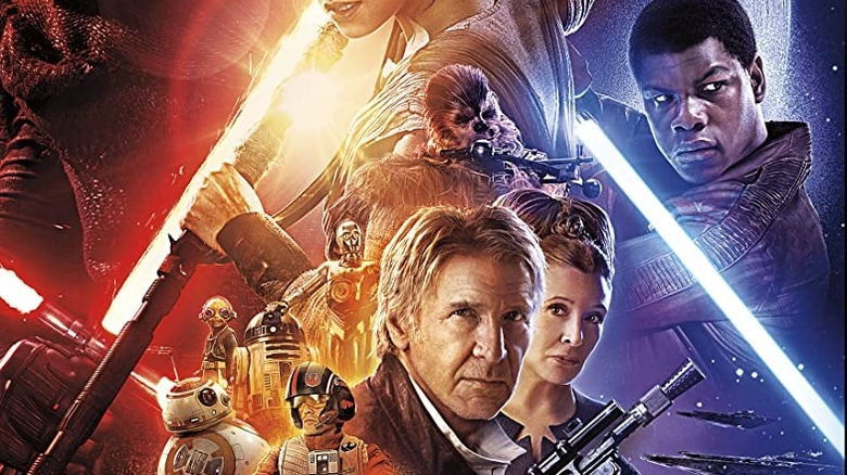 Cast of Star Wars: The Force Awakens posing heroically