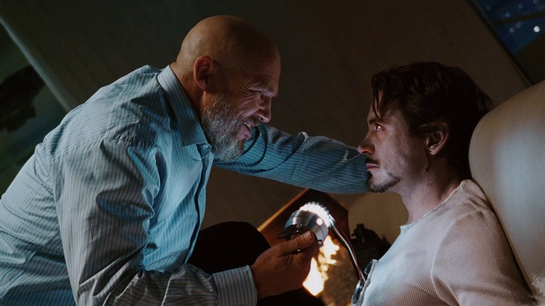 Obadiah Stane holding Tony's heart