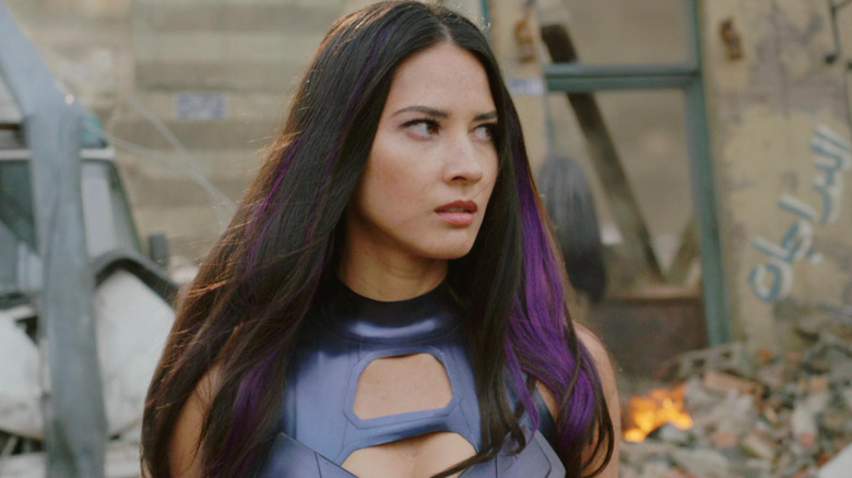Psylocke standing amidst rubble