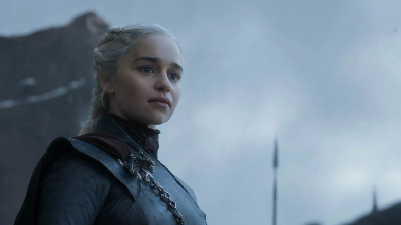 Emilia Clarke as Daenerys Targaryen looks concerned in Game of Thrones.