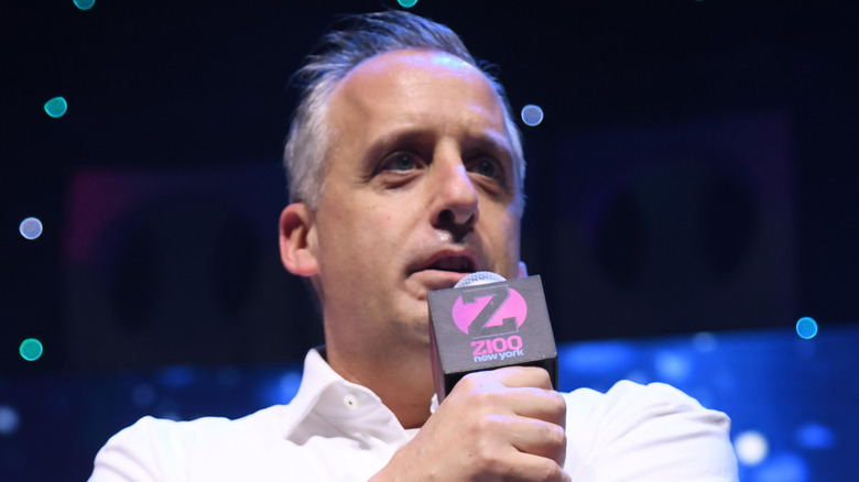 Joe Gatto talking into a mic onstage