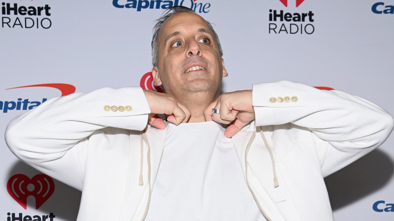 Joe Gatto adjusting his collar on the red carpet