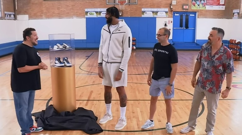 Anthony Davis presenting Sal with sneakers