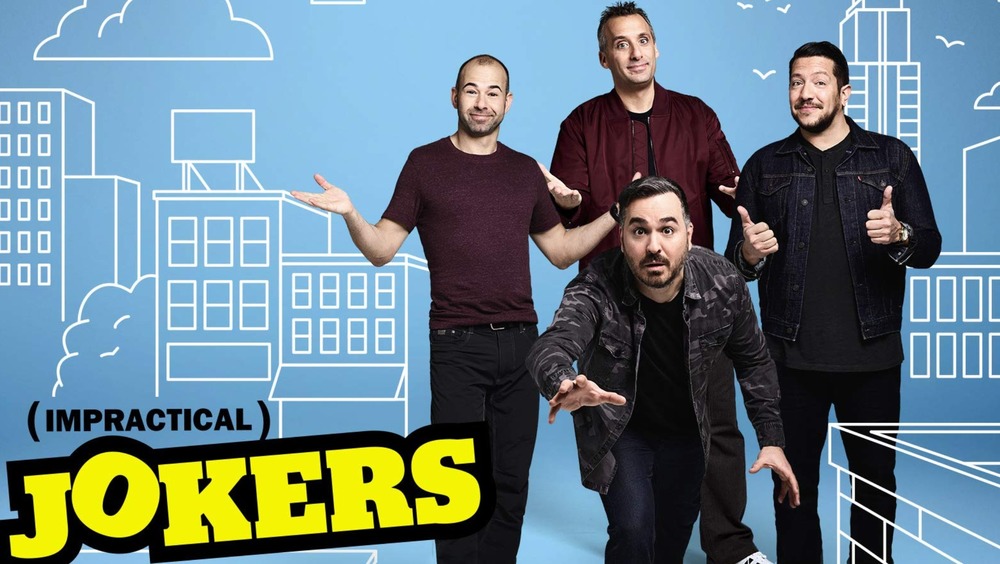 The Impractical Jokers cast pose in front of cartoon New York skyline