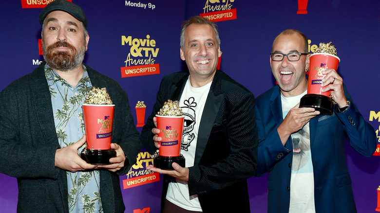 Impractical Jokers posing with awards