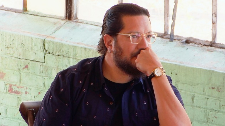 Sal leaning his face on his fist