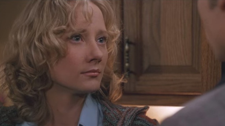 Anne Heche looking frustrated talking to her husband