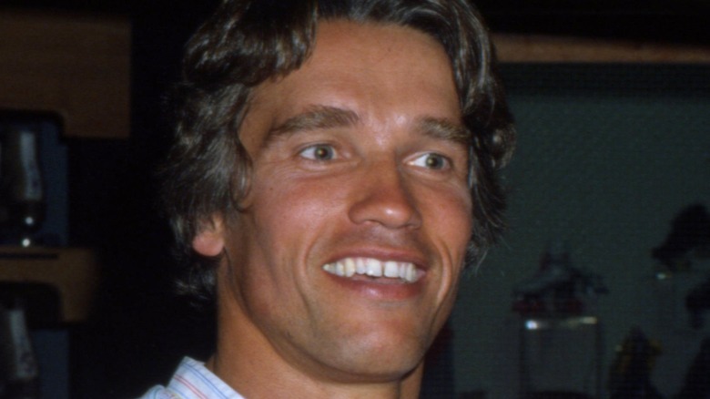 Young Arnold Schwarzenegger smiling