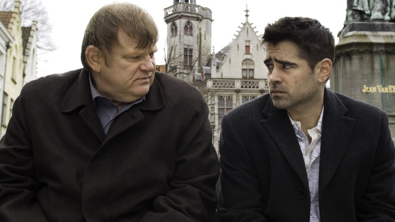 Colin Farrell and Brendan Gleeson on a city bench