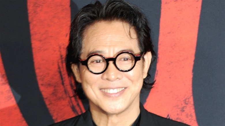 Jet Li smiling in glasses