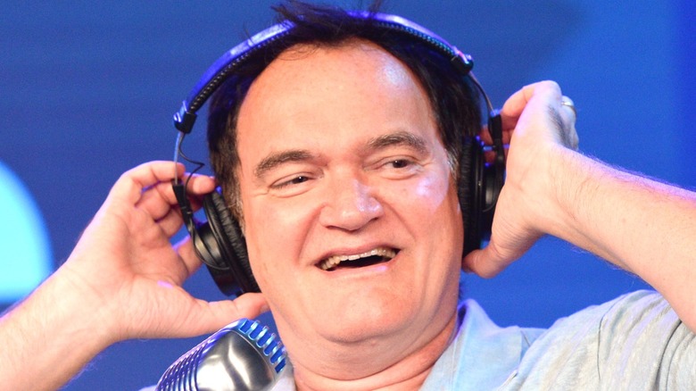 Tarantino laughing with headphones