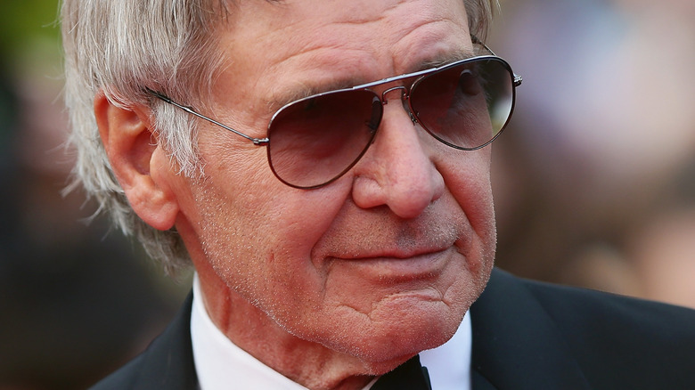 Harrison Ford at event in shades