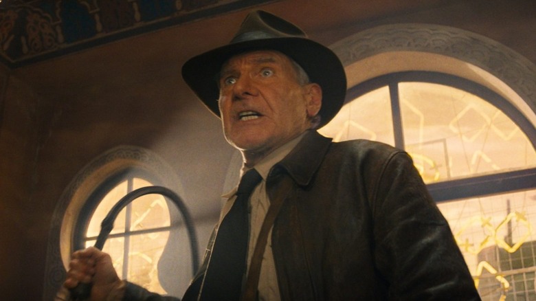 Indiana Jones brandishing a whip 