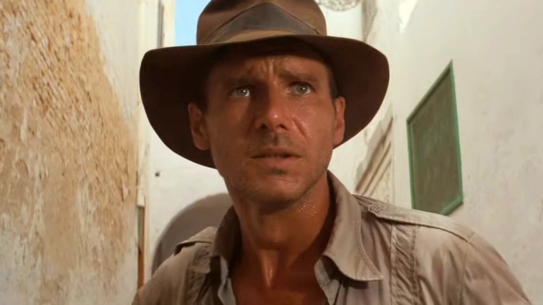 Indiana Jones standing in alley