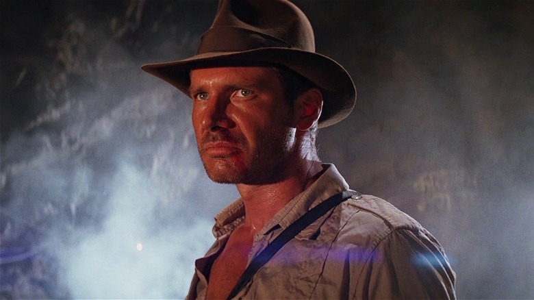 Indiana Jones standing in a cave in Indiana Jones and the Temple of Doom (1984)