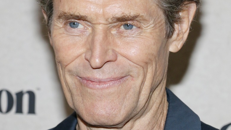 Willem Dafoe smiling