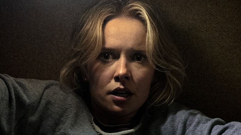 Gemma looking scared trapped in the couch in 