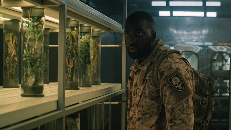 Trevante Cole looking at plant vials