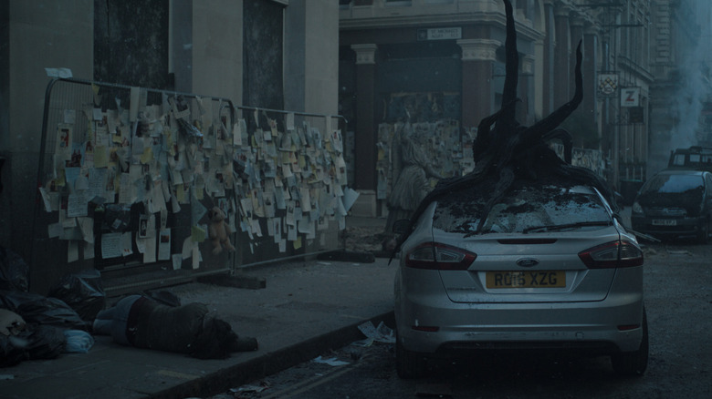 Wrecked car with alien plant