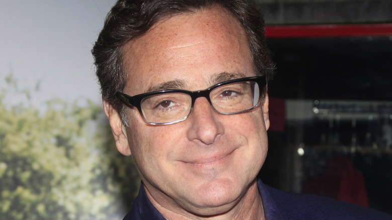 Bob Saget smiling in glasses