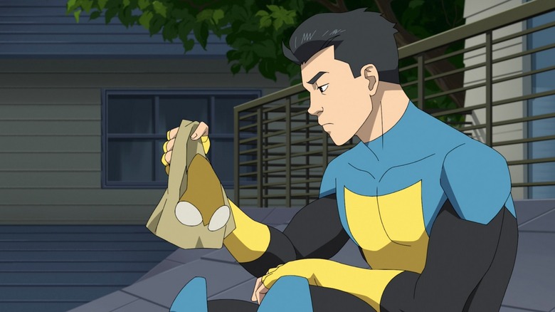 Mark holding Invincible mask