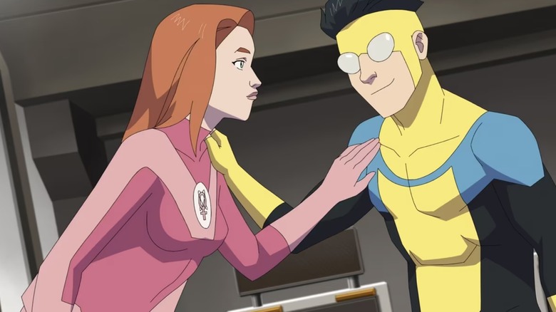 Atom Eve and Invincible touching each other's shoulder