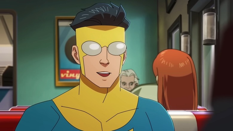 Invincible smiling in diner 