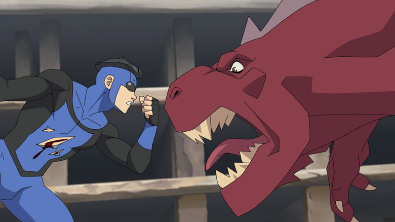 Invincible holding out a fist in front of Dinosaurus on Invincible