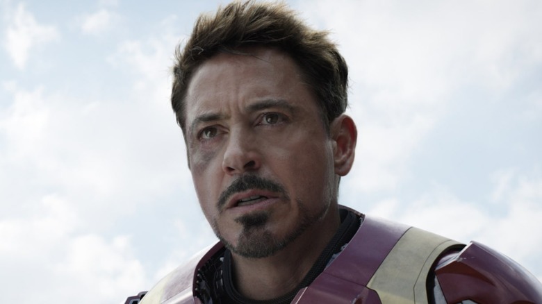 Iron Man stand over War Machine