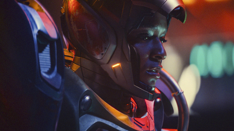 Riri wearing her suit with the helmet open
