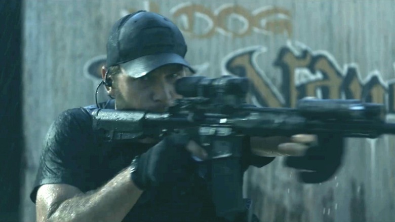 James Reece holding a gun