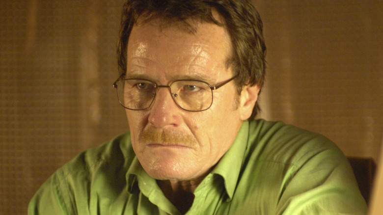 Walter White wears a green shirt and glasses