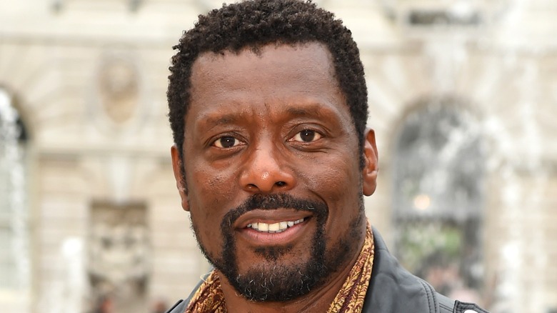 Eamonn Walker smiling slightly