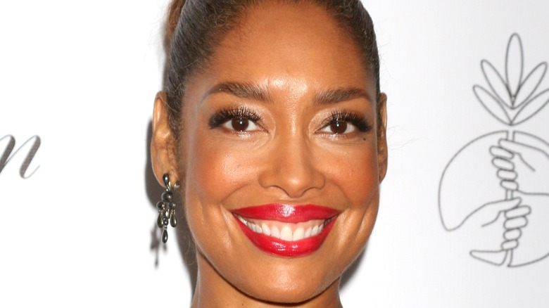 Gina Torres posing and smiling