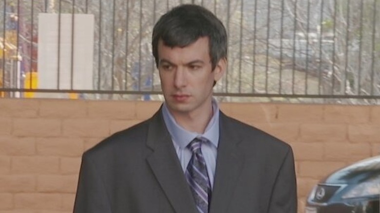 Nathan Fielder wearing an oversized suit