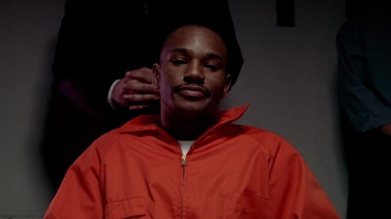Rico in prison uniform