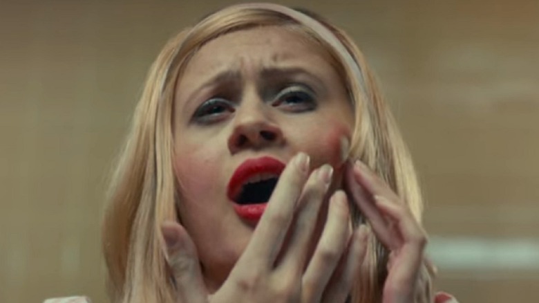 Young woman with a large sore on her cheek