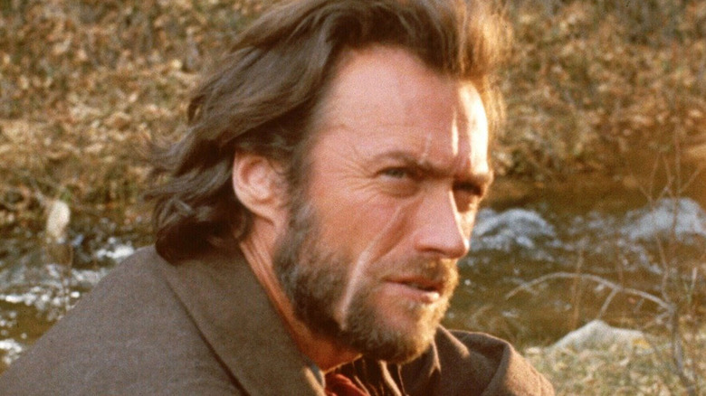 Josey Wales seated on the ground
