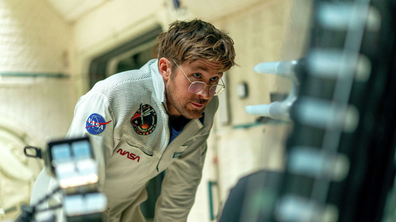 Ryland looking at something on the ship in Project Hail Mary