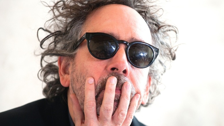 Tim Burton hand on face