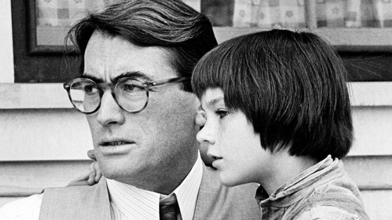 Atticus and Scout Finch in front of a house in 