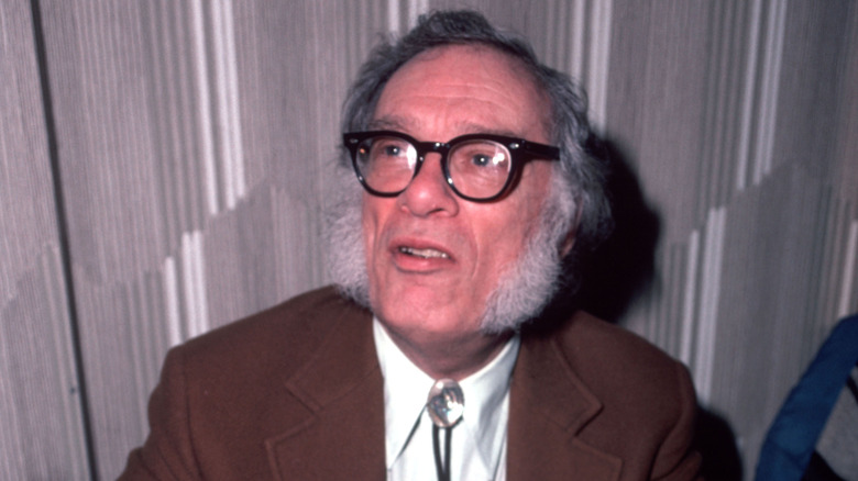 Isaac Asimov sitting at a Science Fiction convention (1982)
