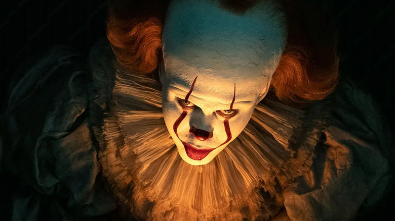 Pennywise illuminated by candle light
