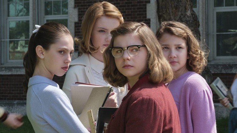 Group of young girls looking suspicious in It: Welcome to Derry