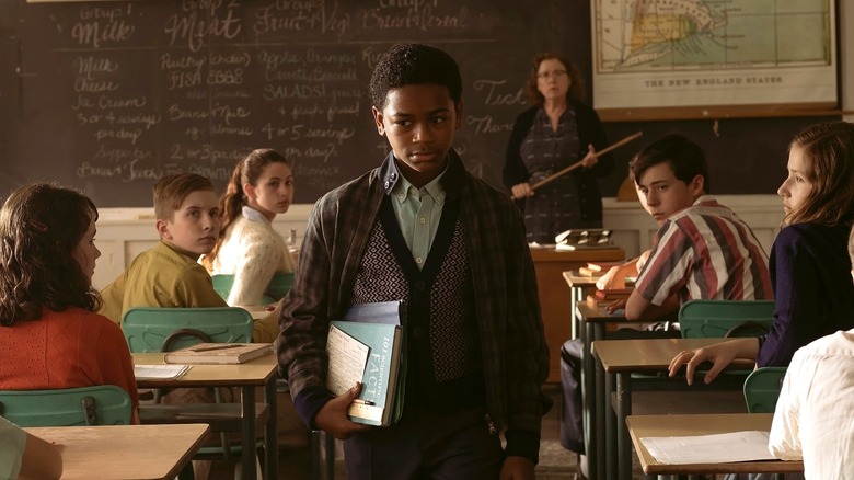 Will Hanlon walking in class while students turn to look at him