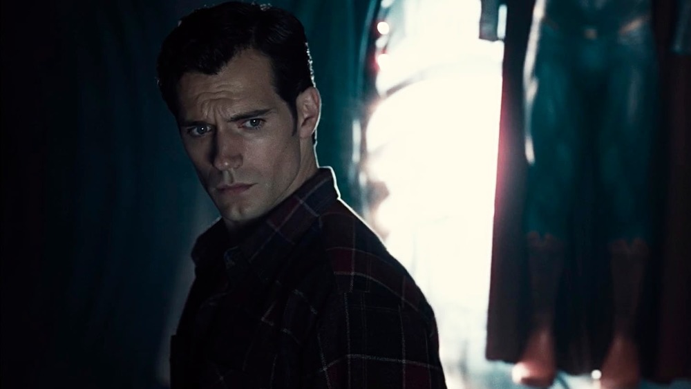 Superman walks by his classic suit