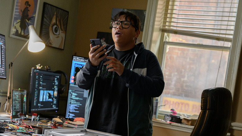 At his desk, Ned looks up from his phone in surprise in "Spider-Man: Brand New Day" (2026)