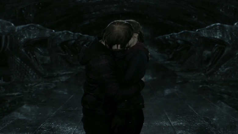 Ron and Hermione kiss