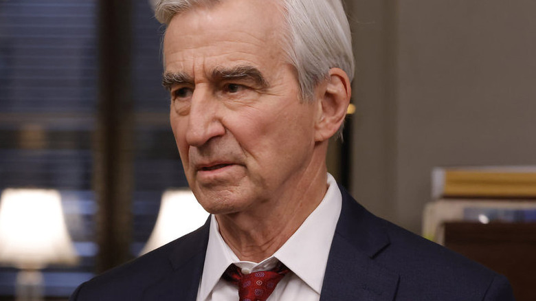 Jack McCoy wearing red tie