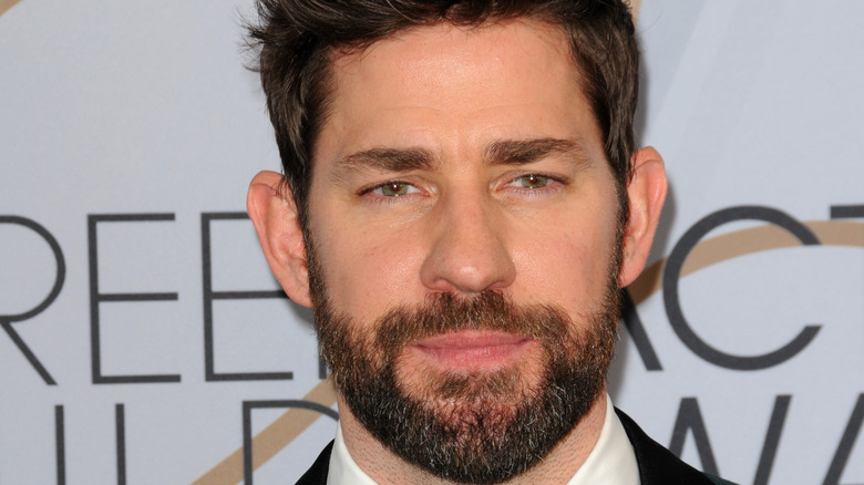 John Krasinski looking into camera